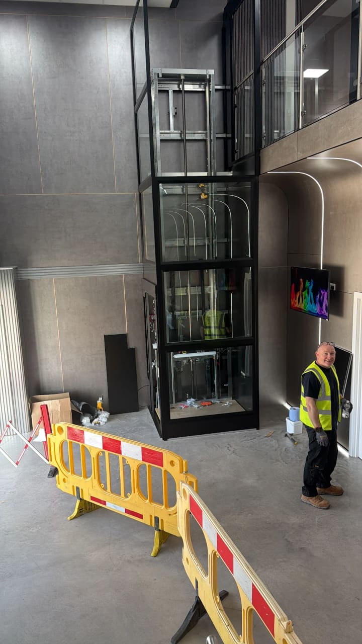 Glass lift shaft during installation by Direct Lift Solutions