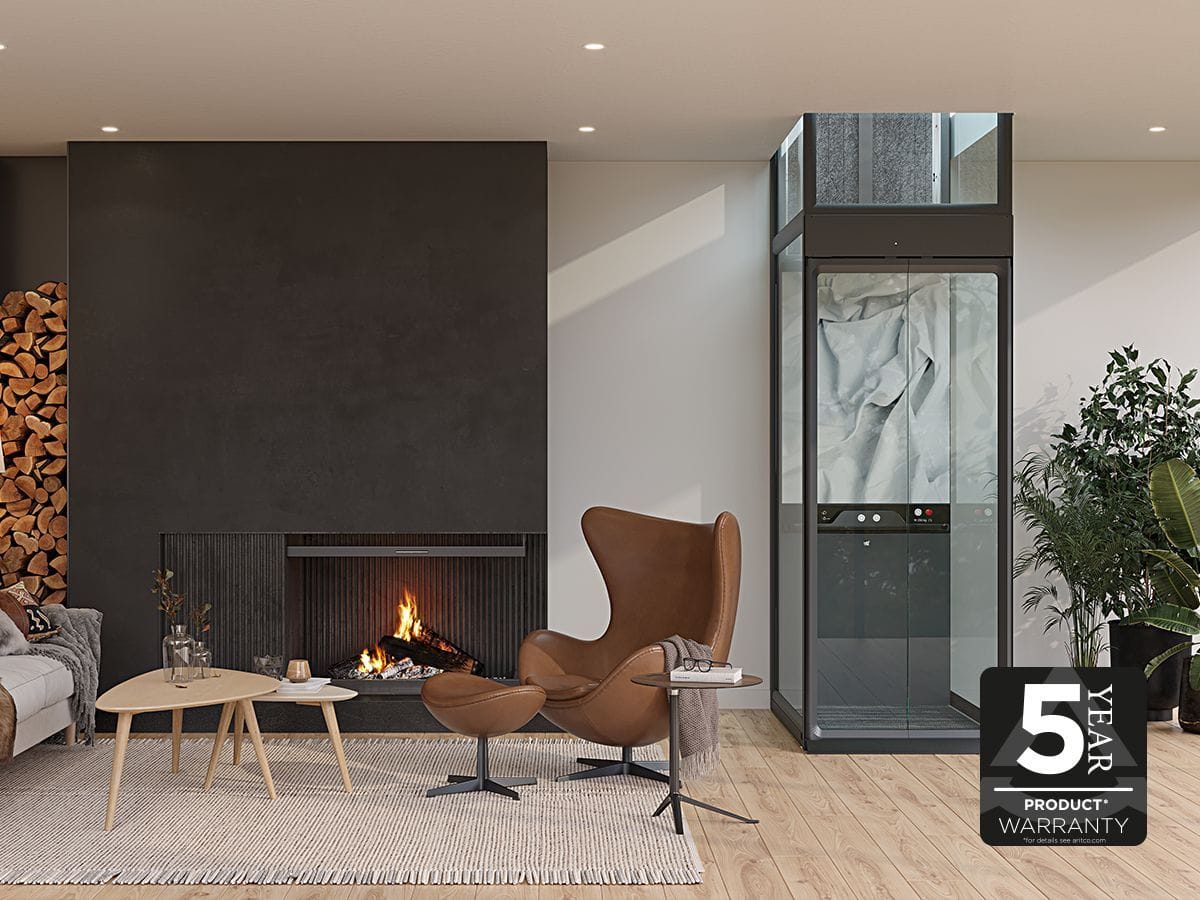Aritco HomeLift Compact beside a fireplace