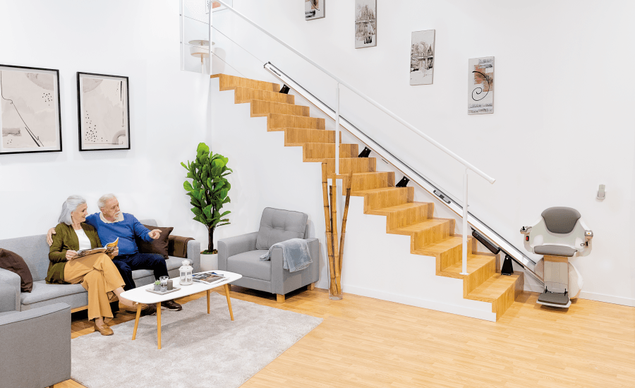 TKE S100 stairlift parked neatly at the foot of the stairs